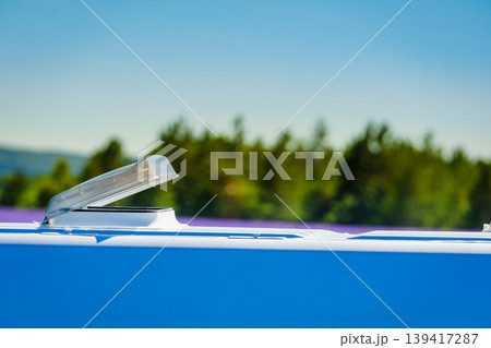 Sunroof, raisable window on roof top of recreational vehicle. Caravan detail 139417287