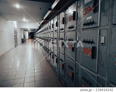A row of vibrant, colorful lockers in a bustling public building, offering secure storage for personal belongings. 139418142