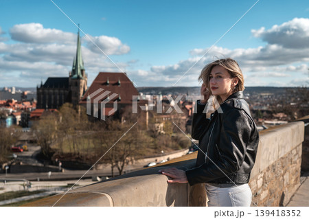 Woman at Scenic European Viewpoint with Historic Church Woman at Scenic European Viewpoint with Historic Church 139418352