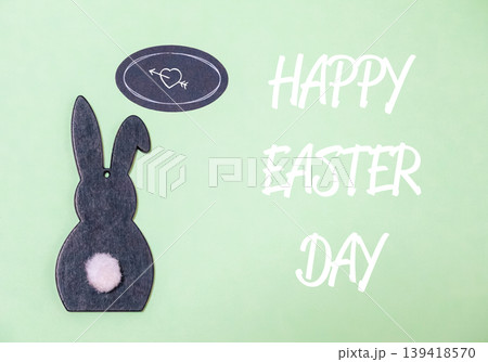 Rabbit is on a green background with a heart and an arrow Rabbit is on a green background with a heart and an arrow 139418570