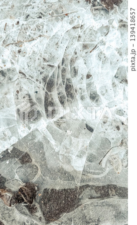 Abstract close-up of cracked ice surface with intricate patterns and textures, showcasing natural beauty and unique formations in a frozen environment Abstract close-up of cracked ice surface with intricate patterns and textures, showcasing natural beauty and unique formations in a frozen environment 139418657