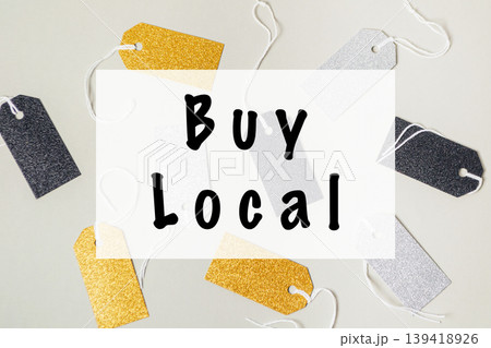 Colorful tags with 'Buy Local' message on a light background promoting local shopping initiative Colorful tags with 'Buy Local' message on a light background promoting local shopping initiative 139418926