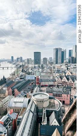 Aerial view of urban skyline with modern buildings and historical architecture in the foreground Aerial view of urban skyline with modern buildings and historical architecture in the foreground 139418936