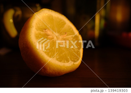 close up of fresh lemon on wooden table close up of fresh lemon on wooden table 139419303