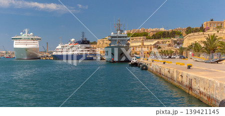 Cruise and naval ships in harbor of Valletta Malta with waterfront and fortifications 139421145