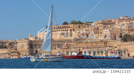 Sailing yacht in Grand Harbour with historic Valletta waterfront Malta 139421155