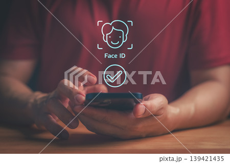 Biometric facial recognition on a smartphone for secure digital authentication and mobile access. Advanced technology for face identification and data security. Biometric facial recognition on a smartphone for secure digital authentication and mobile access. Advanced technology for face identification and data security. 139421435