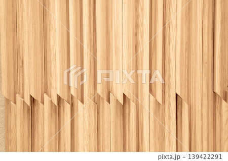 Modern interior wall detail with vertical light oak wooden slats. Decorative wood paneling with creative overlapping zigzag joinery. Natural wood grain texture background for design. Modern interior wall detail with vertical light oak wooden slats. Decorative wood paneling with creative overlapping zigzag joinery. Natural wood grain texture background for design. 139422291