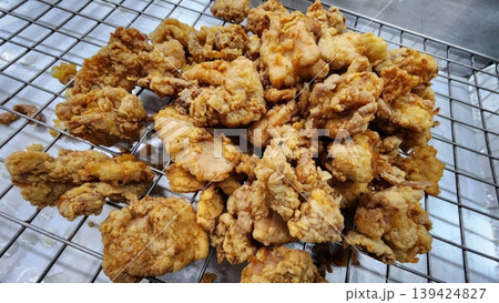 Crispy Golden Brown Deep Fried Chicken Pieces on Cooling Wire Rack Crispy Golden Brown Deep Fried Chicken Pieces on Cooling Wire Rack 139424827