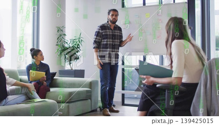 Pointing man wearing plaid shirt, jeans explaining on whiteboard in office lounge with binary code Pointing man wearing plaid shirt, jeans explaining on whiteboard in office lounge with binary code 139425015