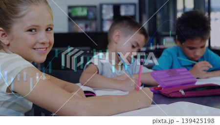 Smiling girl student writing at classroom table with notebooks pens and chart overlay, copy space 139425198