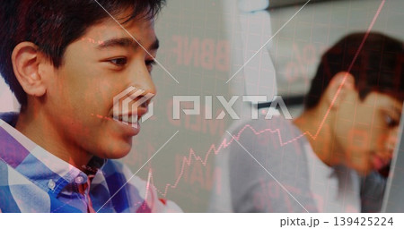 Two teenage boys wearing checkered shirt and grey tee studying in study space, stock chart overlay Two teenage boys wearing checkered shirt and grey tee studying in study space, stock chart overlay 139425224