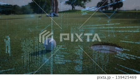 Adult golfer aligning steel putter behind white ball near hole on putting green, with data overlay Adult golfer aligning steel putter behind white ball near hole on putting green, with data overlay 139425469