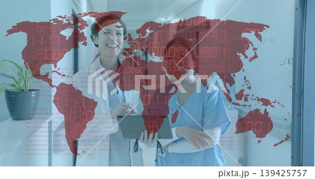 Doctor and nurse reviewing tablet data in hospital corridor, showing red world map with binary code Doctor and nurse reviewing tablet data in hospital corridor, showing red world map with binary code 139425757