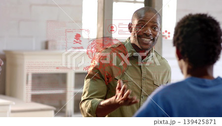 Gesturing Black male in olive green shirt speaking at office meeting with red holographic overlay Gesturing Black male in olive green shirt speaking at office meeting with red holographic overlay 139425871