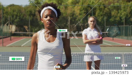 Serving adult tennis player wearing white tank and skirt on green court, holding ball with overlays 139425973