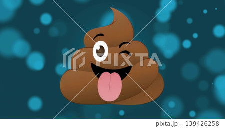 Showing brown poop emoji winking and sticking tongue out on dark teal background, with bokeh lights Showing brown poop emoji winking and sticking tongue out on dark teal background, with bokeh lights 139426258