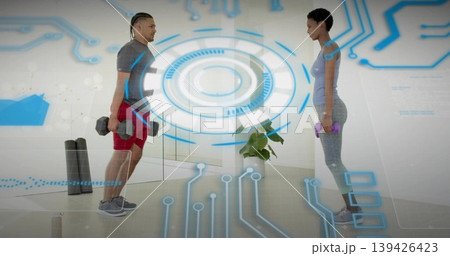 Lifting fitness partners executing hex dumbbell routines in home workout room, with HUD overlay Lifting fitness partners executing hex dumbbell routines in home workout room, with HUD overlay 139426423