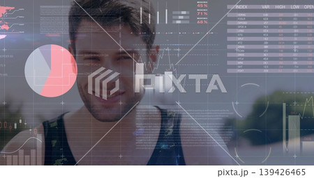Standing athlete wearing black green tank top on park path, with stock data charts overlaying 139426465