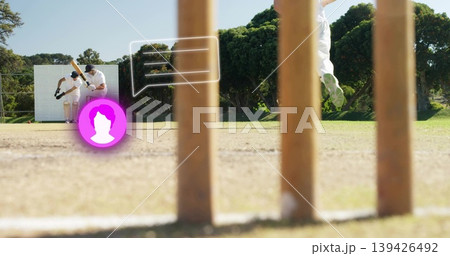 Swinging batsman facing wicketkeeper on cricket pitch, with stumps, speech overlay and avatar icon Swinging batsman facing wicketkeeper on cricket pitch, with stumps, speech overlay and avatar icon 139426492
