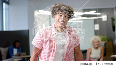 Smiling man wearing pink-striped shirt standing in office lounge, with digital swirl overlay Smiling man wearing pink-striped shirt standing in office lounge, with digital swirl overlay 139426606