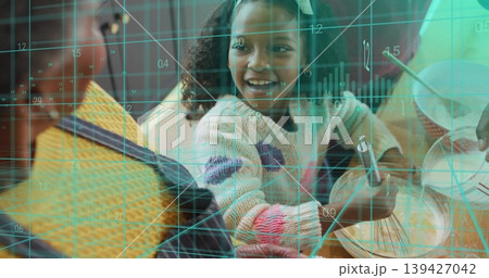 Mixing child wearing pastel sweater stirring batter at table with metal whisk and teal grid overlay Mixing child wearing pastel sweater stirring batter at table with metal whisk and teal grid overlay 139427042