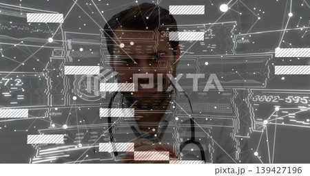 Examining physician in lab coat using holographic UI at clinic, with stethoscope and numeric codes Examining physician in lab coat using holographic UI at clinic, with stethoscope and numeric codes 139427196
