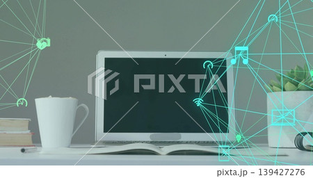Showing centered laptop resting on white tabletop with open book, coffee mug, teal overlay Showing centered laptop resting on white tabletop with open book, coffee mug, teal overlay 139427276