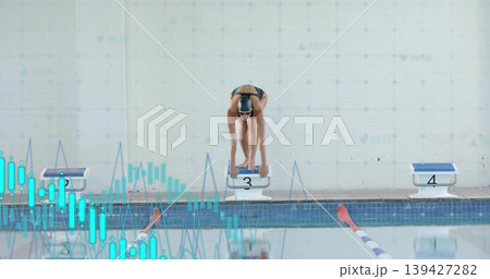 Preparing swimmer bending on block 3 poolside with block 4, dark swimwear, cap goggles data-graph Preparing swimmer bending on block 3 poolside with block 4, dark swimwear, cap goggles data-graph 139427282