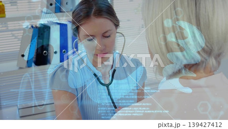 Listening clinician in scrubs placing stethoscope on patient chest in exam room, with lung overlays Listening clinician in scrubs placing stethoscope on patient chest in exam room, with lung overlays 139427412