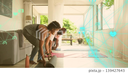 Preparing 3 women in activewear unrolling yoga mats in living room, water bottle, turquoise overlay Preparing 3 women in activewear unrolling yoga mats in living room, water bottle, turquoise overlay 139427643