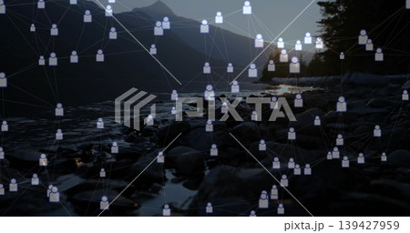 Overlaying avatar network and lines spanning lakeshore at sunset over rocks, pools, ridge, trees Overlaying avatar network and lines spanning lakeshore at sunset over rocks, pools, ridge, trees 139427959