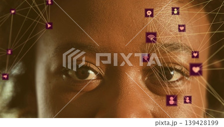 Gazing mid adult woman holding steady gaze in studio close-up, with purple AR icons overlaying face Gazing mid adult woman holding steady gaze in studio close-up, with purple AR icons overlaying face 139428199