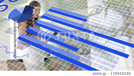 Viewing woman wearing white blazer patterned top at desk, with blue charts, binary grid, copy space 139428298