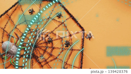 Displaying black tinsel spider web on orange backdrop, showing small spiders and cyan HUD overlays Displaying black tinsel spider web on orange backdrop, showing small spiders and cyan HUD overlays 139428376