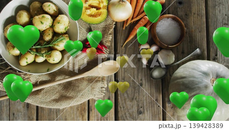 Featuring white bowl of potatoes with rosemary on wood table with wooden spoon, hearts, copy space Featuring white bowl of potatoes with rosemary on wood table with wooden spoon, hearts, copy space 139428389