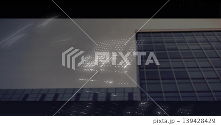 Reflecting glass high-rise facade showing window grid and LED dots street-level, copy space Reflecting glass high-rise facade showing window grid and LED dots street-level, copy space 139428429