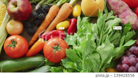 Displaying colorful flat-lay of fresh produce on wooden countertop, featuring tomatoes and labels Displaying colorful flat-lay of fresh produce on wooden countertop, featuring tomatoes and labels 139428556