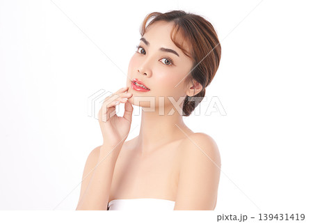A beautiful young Asian woman with clean, fresh skin against a white background. Skincare, facial treatment, cosmetology, beauty, and spa. An elegant portrait of an Asian woman. A beautiful young Asian woman with clean, fresh skin against a white background. Skincare, facial treatment, cosmetology, beauty, and spa. An elegant portrait of an Asian woman. 139431419