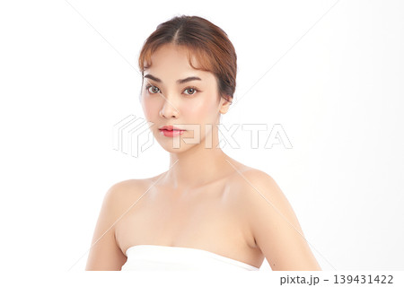 A beautiful young Asian woman with clean, fresh skin against a white background. Skincare, facial treatment, cosmetology, beauty, and spa. An elegant portrait of an Asian woman. 139431422