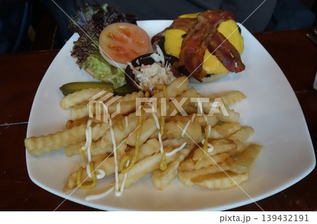 Burger and Fries Plate with Salad and Condiments Burger and Fries Plate with Salad and Condiments 139432191