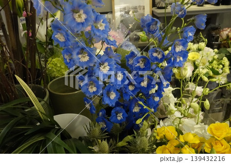 Vibrant Blue Delphiniums Among Floral Arrangements 139432216