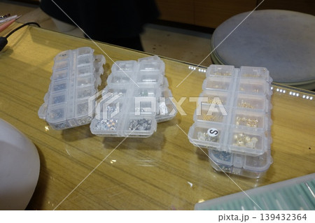 Jewelry Bead Storage Containers on Glass Table Jewelry Bead Storage Containers on Glass Table 139432364