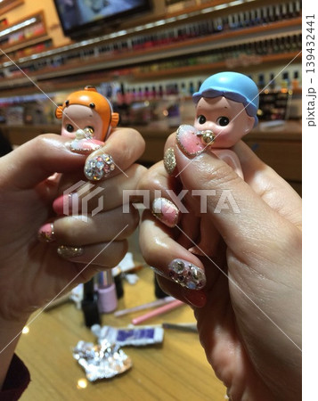 Nail Art with Miniature Dolls in Salon Setting 139432441
