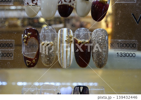 Nail Art Display with Glitter and Gold Accents 139432446