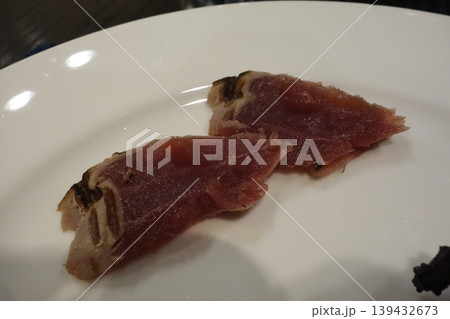 Cured Meat Slices on White Plate 139432673