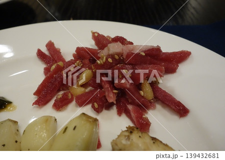 Watermelon and Garlic Garnish on White Plate Watermelon and Garlic Garnish on White Plate 139432681