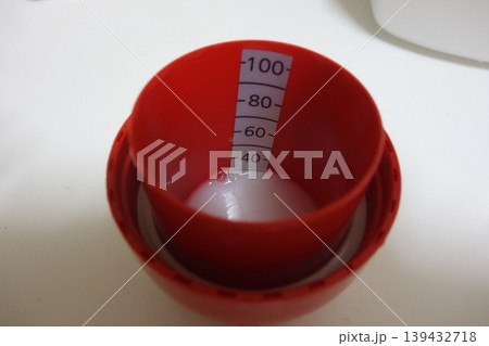 Red Measuring Cup with Liquid 139432718