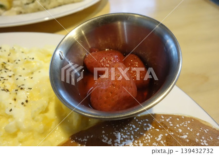 Strawberries in Metal Bowl with Scrambled Eggs and Pancake Strawberries in Metal Bowl with Scrambled Eggs and Pancake 139432732