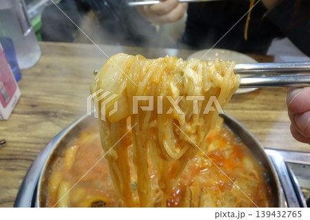 Chopsticks Lifting Noodles from Hot Pot 139432765